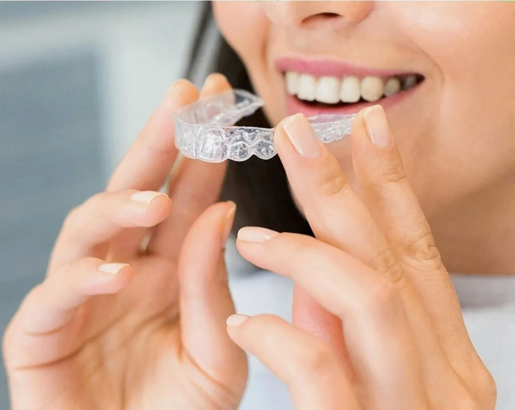 ClearCorrect clear aligner tray being placed over teeth